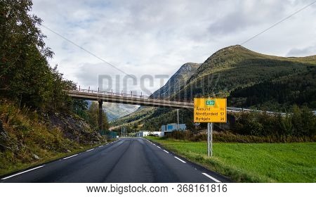 Driving On The E-39 Road And Seeing The Sign With The Information Of Distance For 