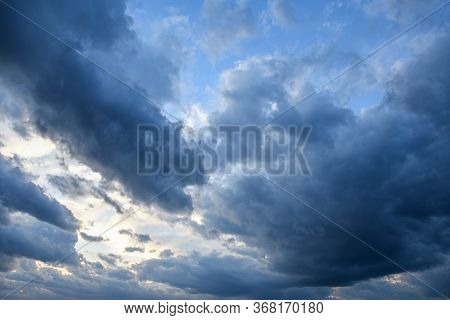 Stormy Sky With Storm Clouns On The Sunset With Beautiful Sun
