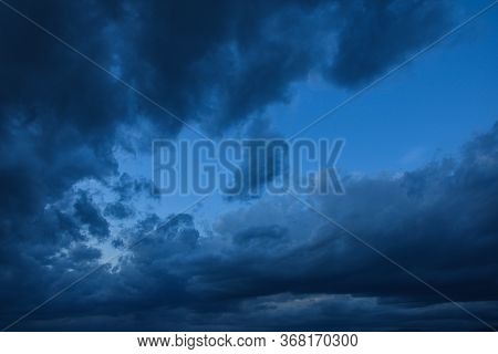 Stormy Sky With Storm Clouns On The Sunset With Beautiful Sun