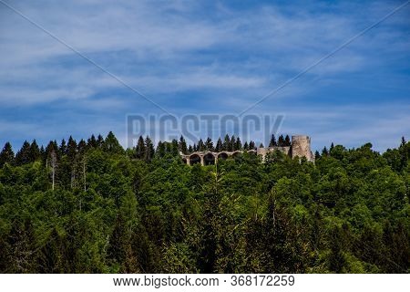 Ancient Walls Rich In History, Bricks And Stones, Arched Doors And Windows Open Glimpses Of Mountain