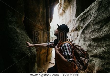A Young Man Geologist Explores A Mountain Cave, Travel Concept