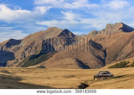 Mountain Landscape In Fagaras Mountains, Romania. In The Background Lespezi Peak 2517m And Negoiu Pe