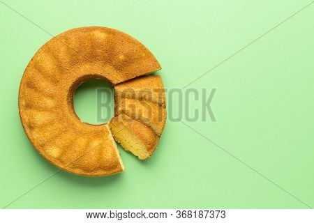 Portuguese Cornmeal Cake, Sliced, On A Green Background. Flat Lay With Festa Junina Traditional Dess