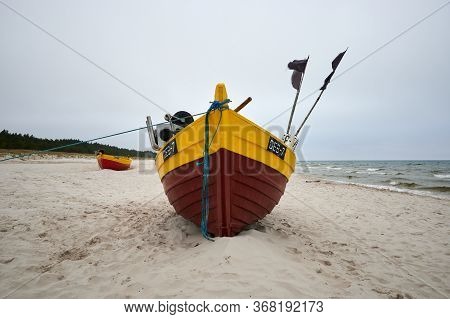 Debki, Poland- May 25, 2020: Fishing Boat On The Beach On A Cloudy And Foggy Day. Baltic Sea, Poland