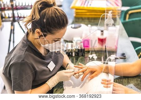 Manicure And Pedicure Beauty Salon With Security Measures. Reopening After The Corod-19 Pandemic. Co