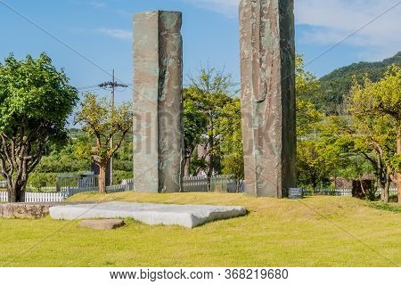 Gimcheon, South Korea; May 24, 2020: Two Huge Granite Columns On Display At Rock Garden Under Blue S