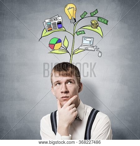 Redhead Student Looks Pensive Upwards And Thinking About Some Genius Idea. Clever Boy With Drawing I
