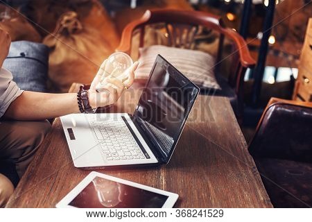 Light Blub On Businessman Hands. Idea, Strategy And Success Concept.