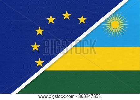 European Union Or Eu And Rwanda Or Ruanda National Flag From Textile. Symbol Of The Council Of Europ
