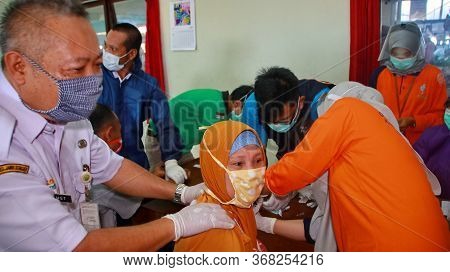Unfocused, Blurry Selective Focus And Noise Image Health Workers When Conducting A Covid 19 Rapid Te