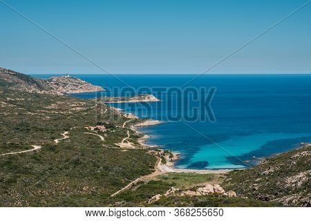 Turquoise Mediterranean Sea At The Plage De L'alga On The Rocky Coast Of La Revellata Near Calvi In 