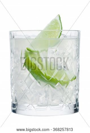 Gimlet Cocktail In Crystal Glass With Ice Cubes And Lime Slices Isolated On White Background.
