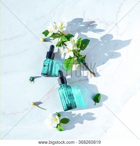 Natural Serums Flat Lay, Minimalism. With Flowers. Concept Of Cosmetic Injection Is Hyaluronic Acid,