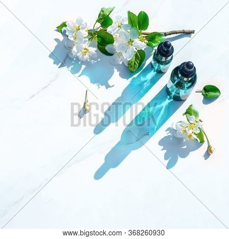 Natural Serums Flat Lay, Minimalism. With Flowers. Concept Of Cosmetic Injection Is Hyaluronic Acid,