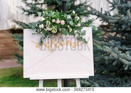 Wedding White Board Mockup Easel With Welcome Sign Decorataed With Flowers, Outdors. Greeting Card T