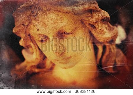 Vintage And Retro Styled Image Of Ancient Stone Statue Of Beautiful Sad Angel As Symbol Of Death And