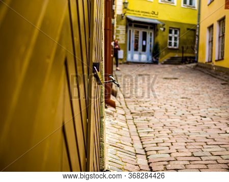 Fragment Of The Old Wrought Doors. Antique Shop Door In Tallinn, Estonia. Closed Business Concept. S