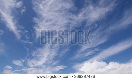 Beautiful Soft Wispy Cloud Formation Against A Deep Blue Sky