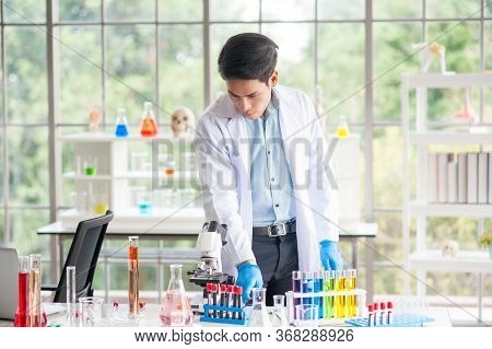 Cience Standing In Lab,science Is Studying Experimental Results Research For Treatment Of Diseases