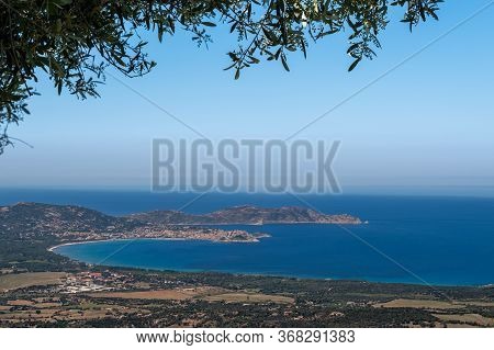 The Citadel And Bay Of Calvi In The Balagne Region Of Corsica With La Revellata Behind And Framed By