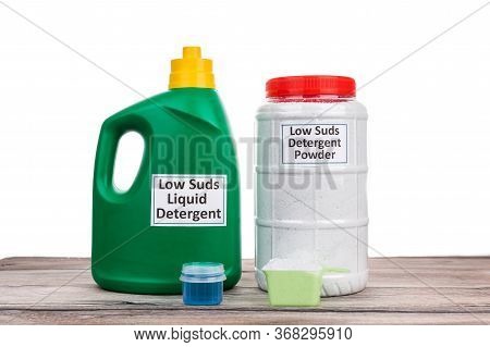 Low Suds  Laundry Detergent For Front Load Washing Machine On Wooden Surface Against White Backgroun