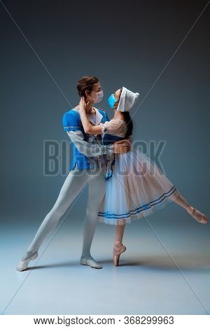 Modern Cinderella Not Trying The Slipper On, But Kissing With Protective Face Mask. Young And Gracef
