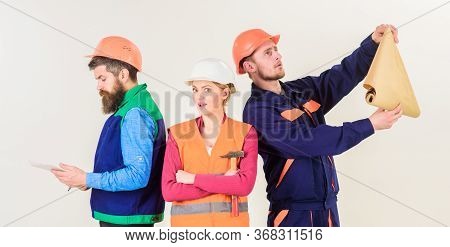 Men And Woman In Helmets Carefree With Hammer And Project,