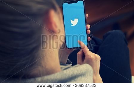 Kyiv, Ukraine-january, 2020: Twitter On Smartphone Screen. Young Girl Pointing Or Texting Twitter On