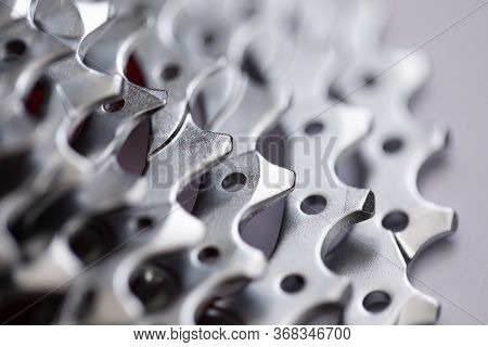 Close-up Of Bicycle Roller Chain That Transfers Power From Pedals To Drive. Macro Shot Of Metal Whee