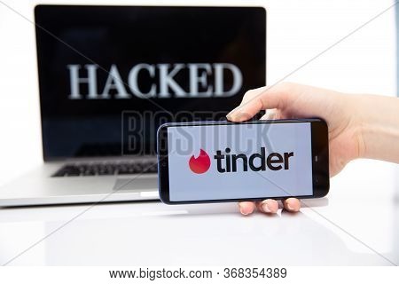 Tula Russia 12.02.2020 Hucked Inscription On The Laptop And Tinder On The Phone Screen.