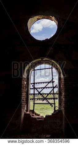 Windows Of An Ancient Temple, In The Wall Of Red Brick, In The Form Of An Arch. The Hole In The Wall