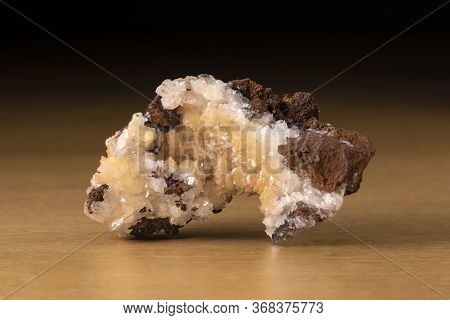 Adamite Mineral From Mexico Over A Wooden Table