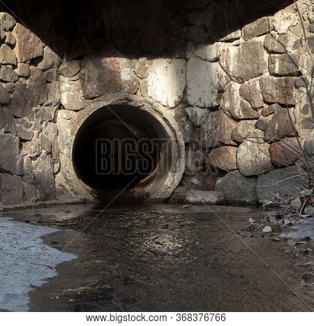 Concrete Run-off Pipe Discharging Water. Drain (drainage) Pipe.