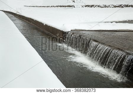 Urban Streams In Winter. The Lybid River (kyiv, Ukraine) In The Snow.