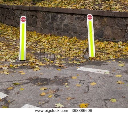 Foldable Street Bollards. No Parking And No Entrance Posts. Delineators. Stop Sign. Asphalt Covered 
