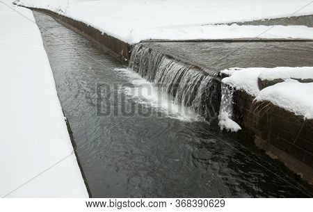 Urban Streams In Winter. The Lybid River (kyiv, Ukraine) In The Snow.
