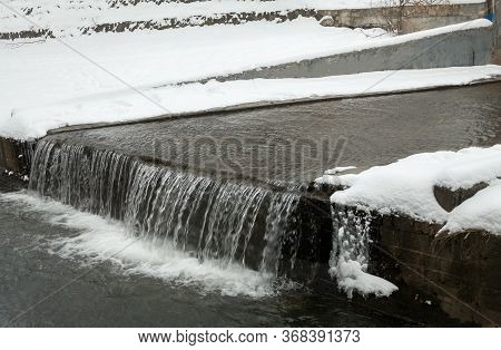 Urban Streams In Winter. The Lybid River (kyiv, Ukraine) In The Snow.