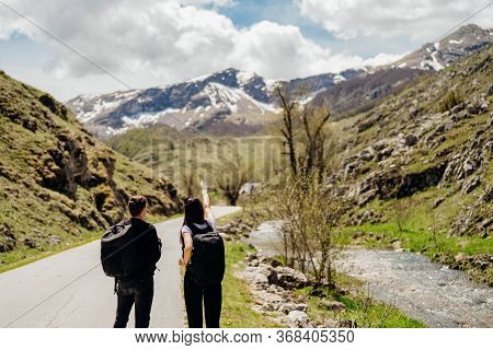 Young Backpacker Hiker Couple Enjoying Relaxing Mountain Hike.active Hiking Trip Vacation.reconnecti