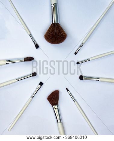 Set Of Makeup Brushes  On A Light Background With A Copy Space In A Circle Form