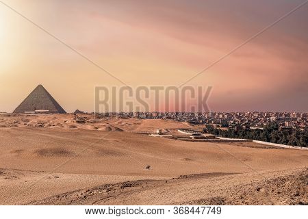 The Great Pyramid Of Khafre In Giza Plateau With Cairo Cityscape On Right Side. Egypt