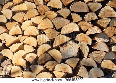 Preparation Of Firewood For The Winter. Firewood Background, Stacks Of Firewood At The Home. Pile Of