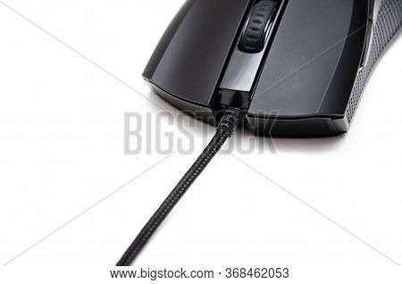 Black Gaming Mouse With Side Extra Keys And A Matte Finish On White Background. Mouse Front View But