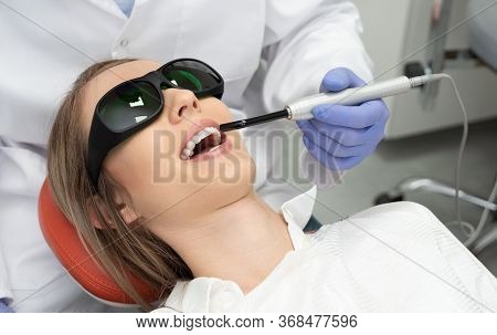 Using A Modern Method Of Laser Teeth Treatment. Dental Care, Perfect Smile