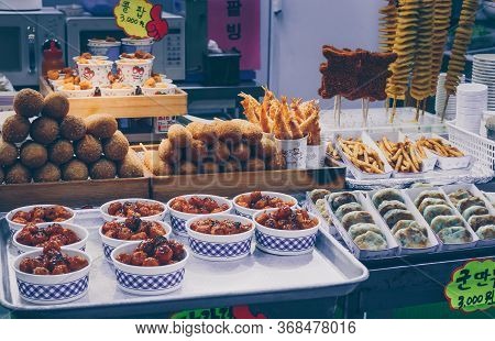 Busan, South Korea, September 14, 2019: Variety Of Korean Street Food On Display: Corn Dogs, Fries, 