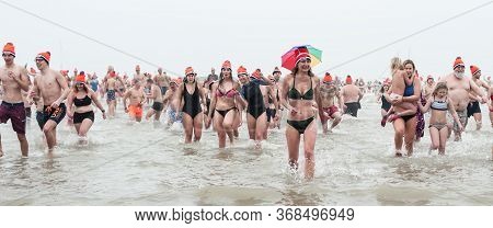 Scheveningen Annual New Year’s Dive And Swim. Typical Dutch Tradition