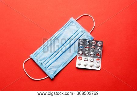Prevent Coronavirus. Medical Mask, Medical Protective Mask Isolated On Red Background. Disposable Su