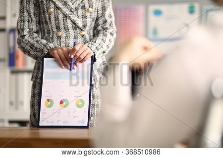 Close-up Of Boss Female Wearing Presentable Stylish Suit And Holding Clipboard With Report. Developm