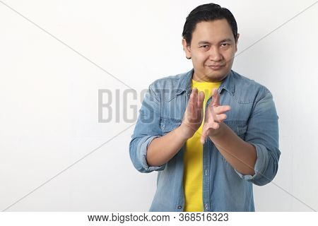 Young Asian Man Wearing White Shirt, Happy Proud Clapping Gesture.over Grey Background, Halfl Body P