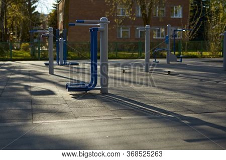 Empty Street Exercise Machines In A Public Place. The Concept Of Ban On Walking.