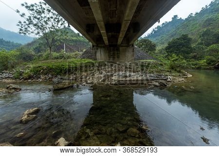Dreaming Under A Bridge Reflection In Moody Weather